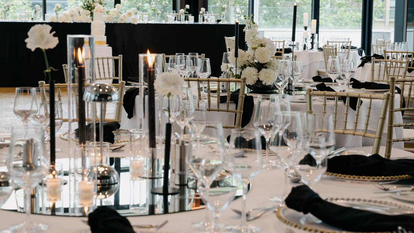 Dark and moody table settings for a wedding reception