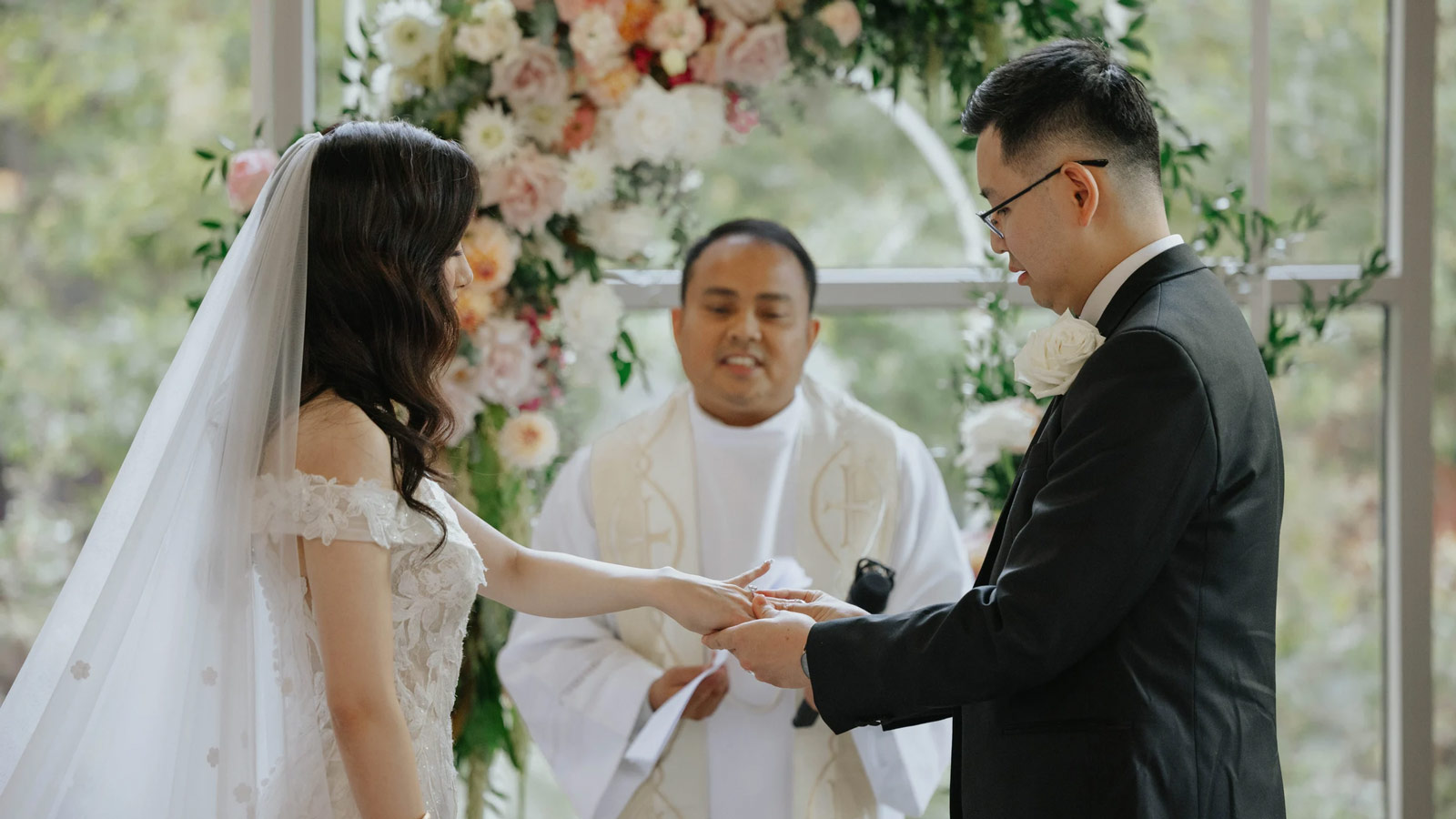 Couple getting married and exchanging rings