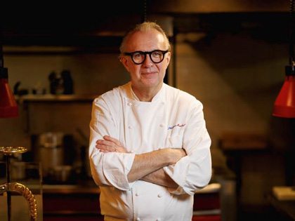 Chef Phillipe Mouchel posing for a photo.