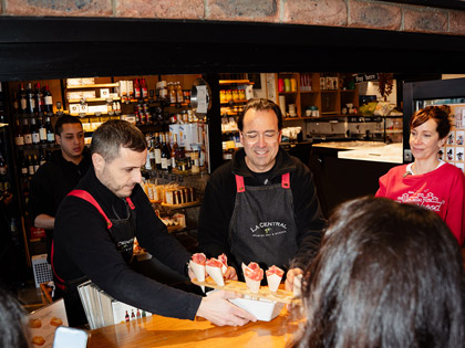 A person serving ice cream at South Melbourne Market food festival. 
