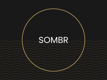 Sombr written in a gold circle
