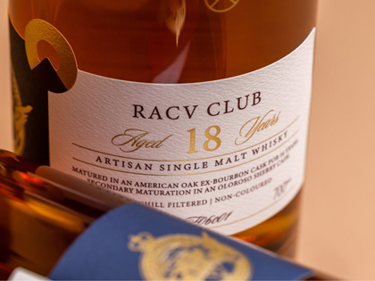 A close up of a 18 yer old bottle of whiskey.