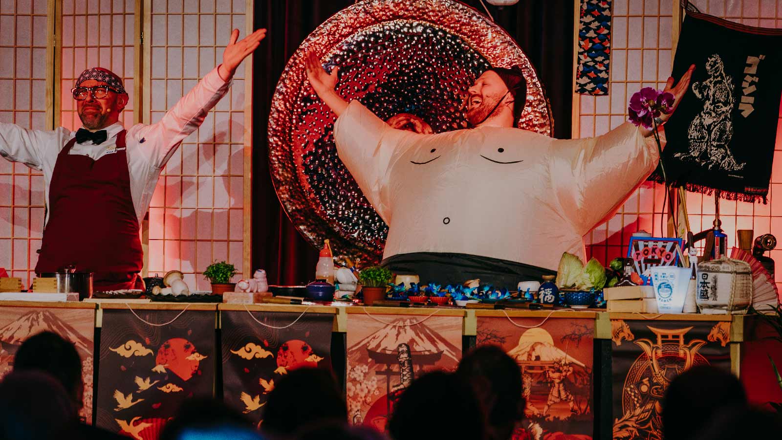 Two chefs engaging with the audience.