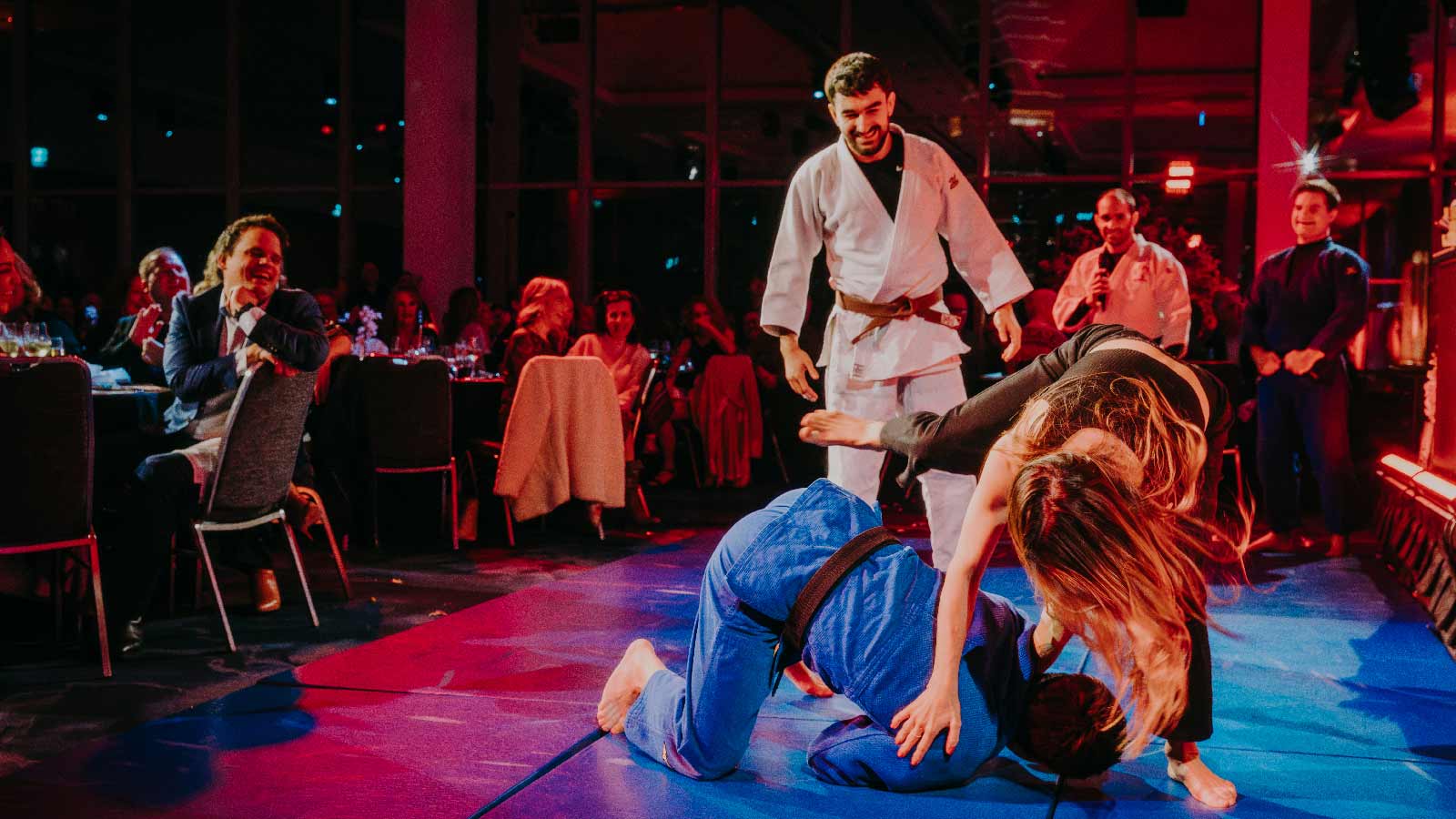 Crowd participation in a Martial Arts display on stage.