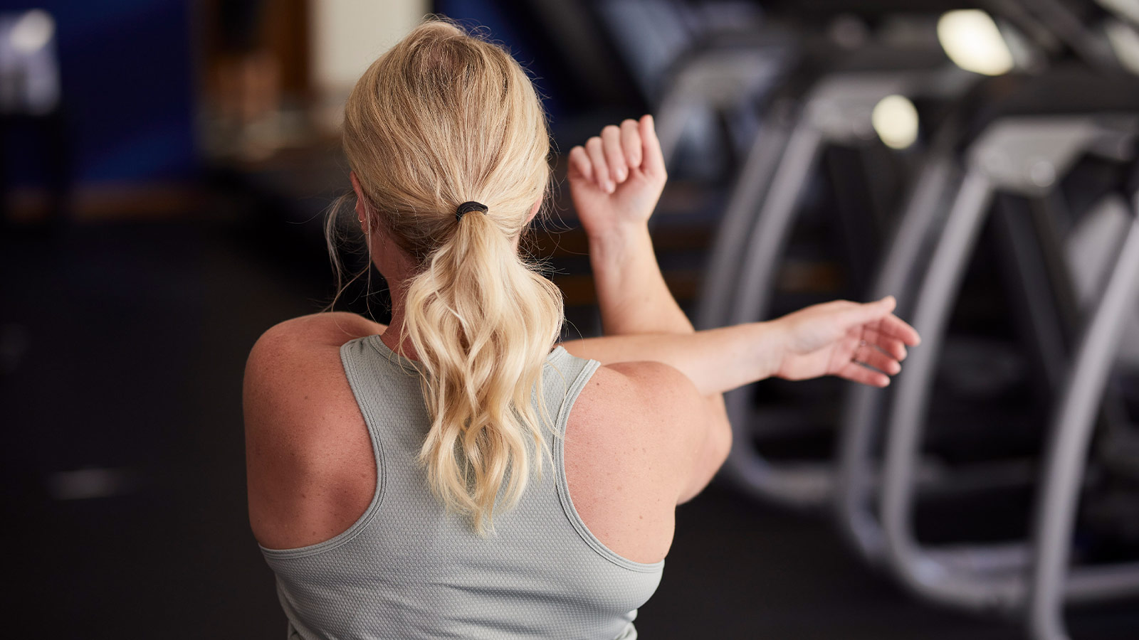 Woman stretching in the gym before a workout.