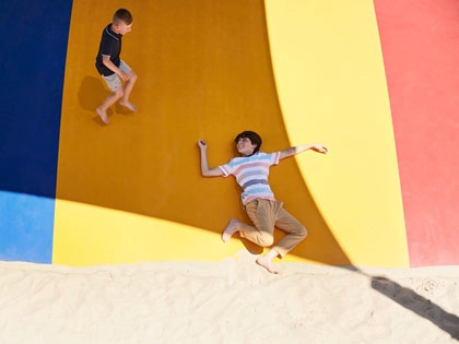 Two boys enjoying the jumping pillows at the Healesville Country Club.