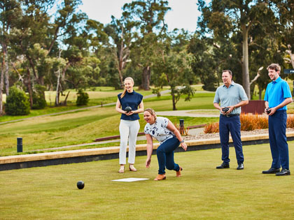 Two couples enjoying lawn bowls at the Healesville Country Club.