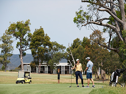 Couple playing golf at Healesville.