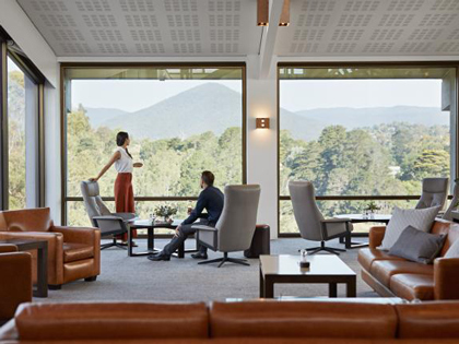 Two people enjoying the view at the members loungs in Healesville