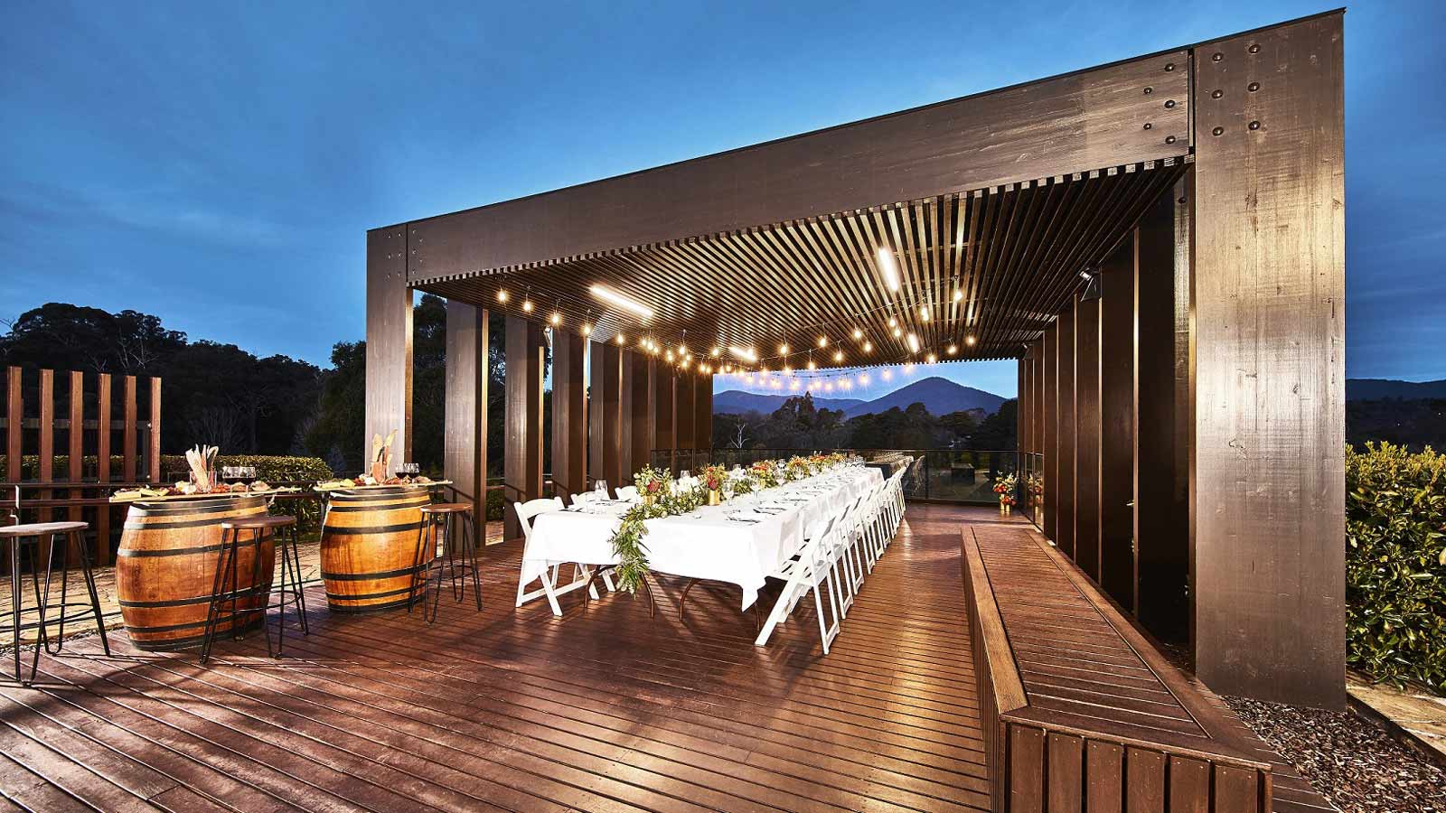 Healesville gazebo set up with a long boardroom table in the evening