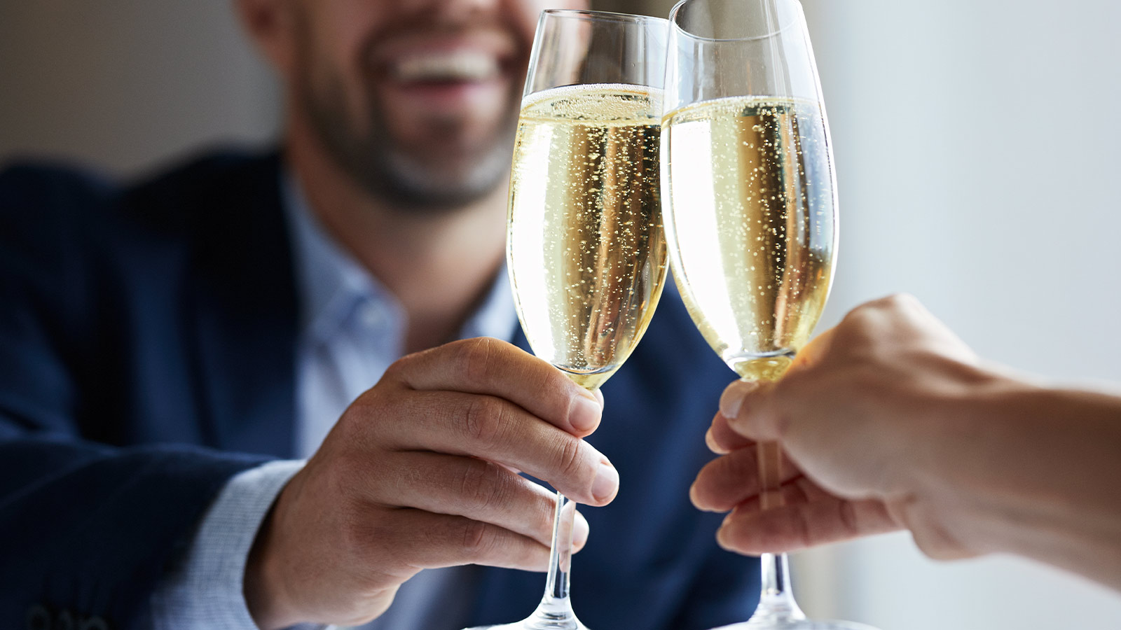 A couple celebrating with a champagne toast.
