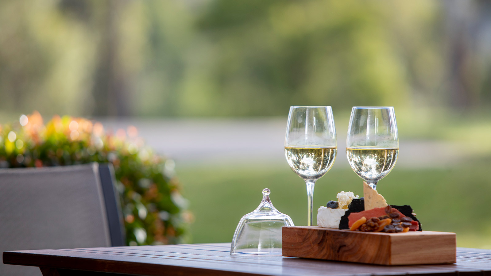 Two wine glasses and a cheeseboard setup at Healesville.