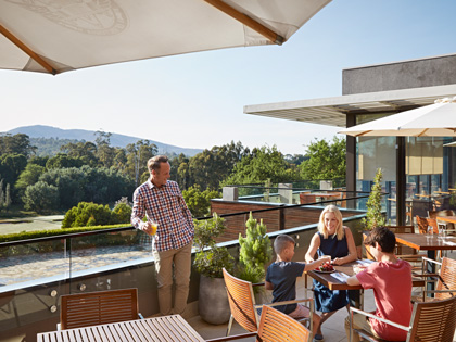 A family enjoying some time in the sun on the Terrace of the Bistro at Healesville.