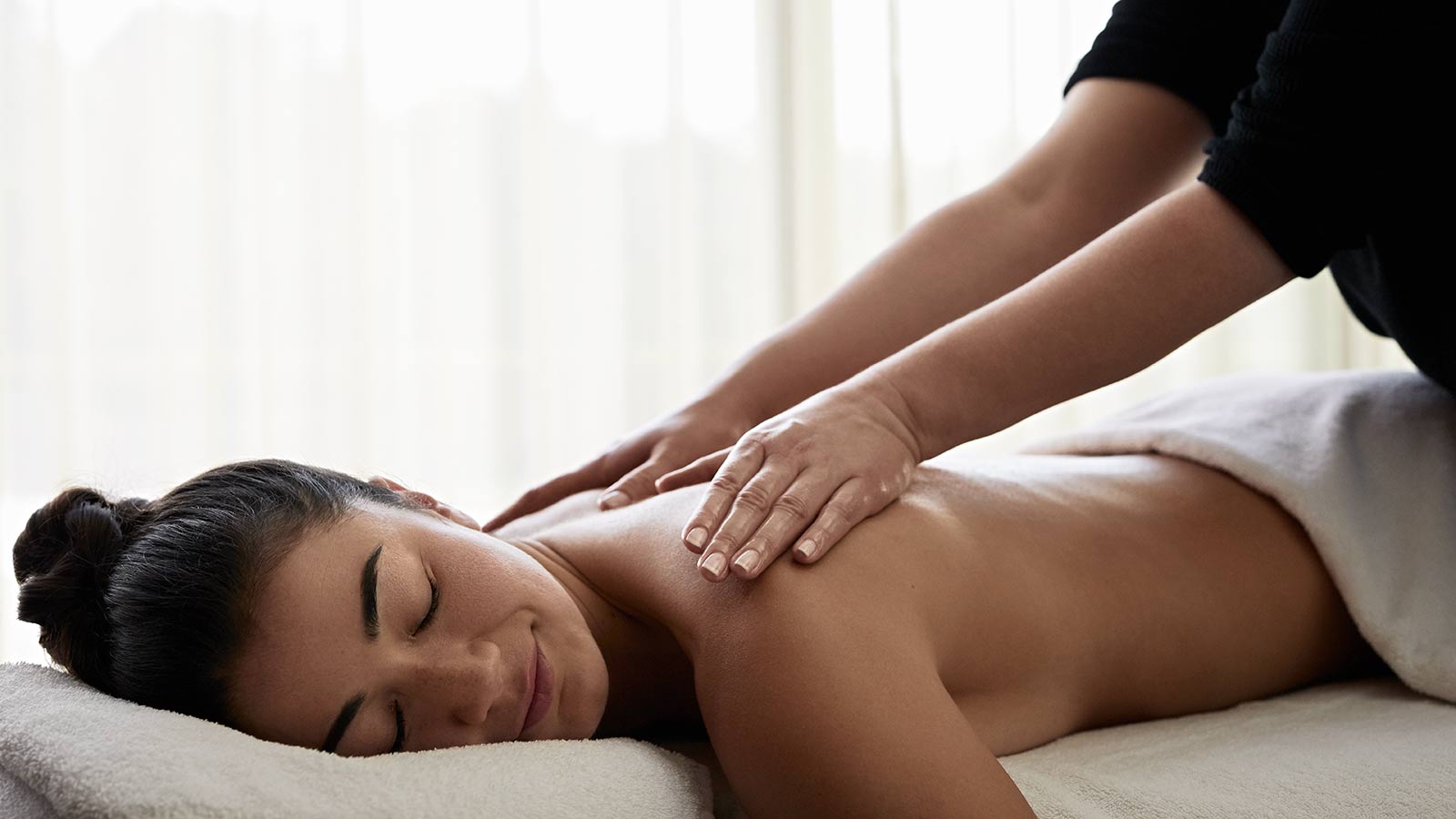 Woman getting a massage at RACV One Spa in Healesville.