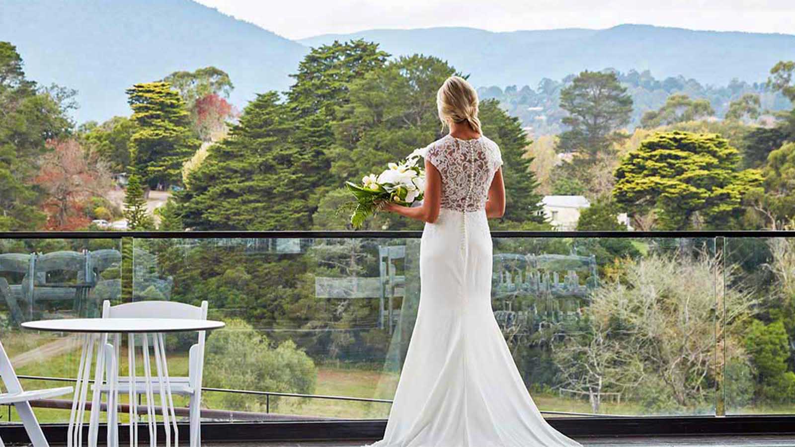 Bride overlooking a balcony at the Healesville Country Club and Resort.