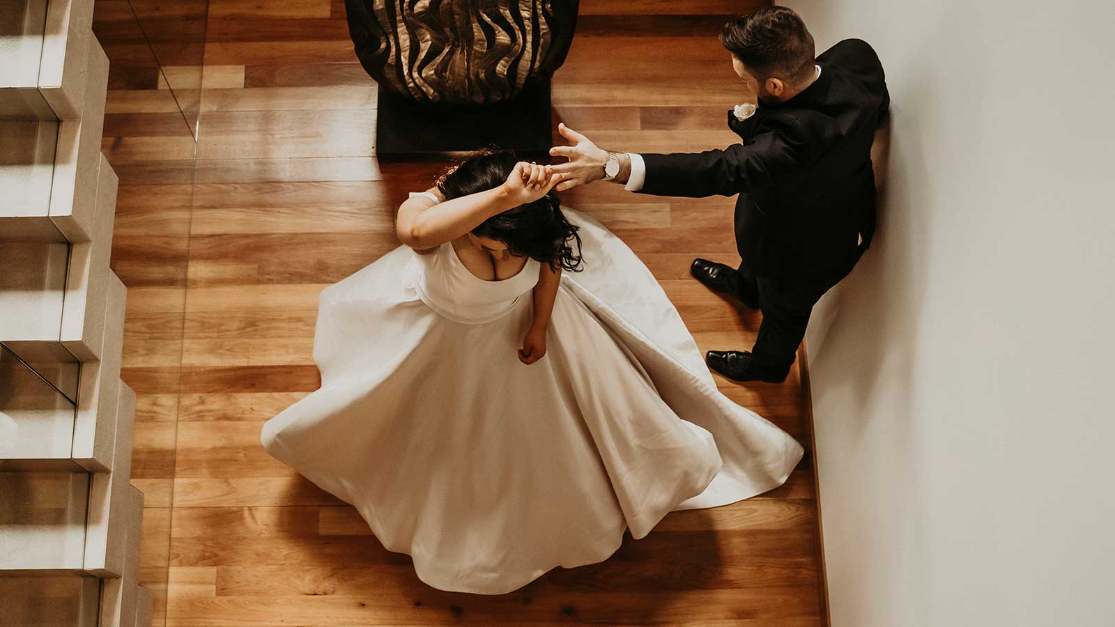 Aerial shot of groom twirling the Bride.
