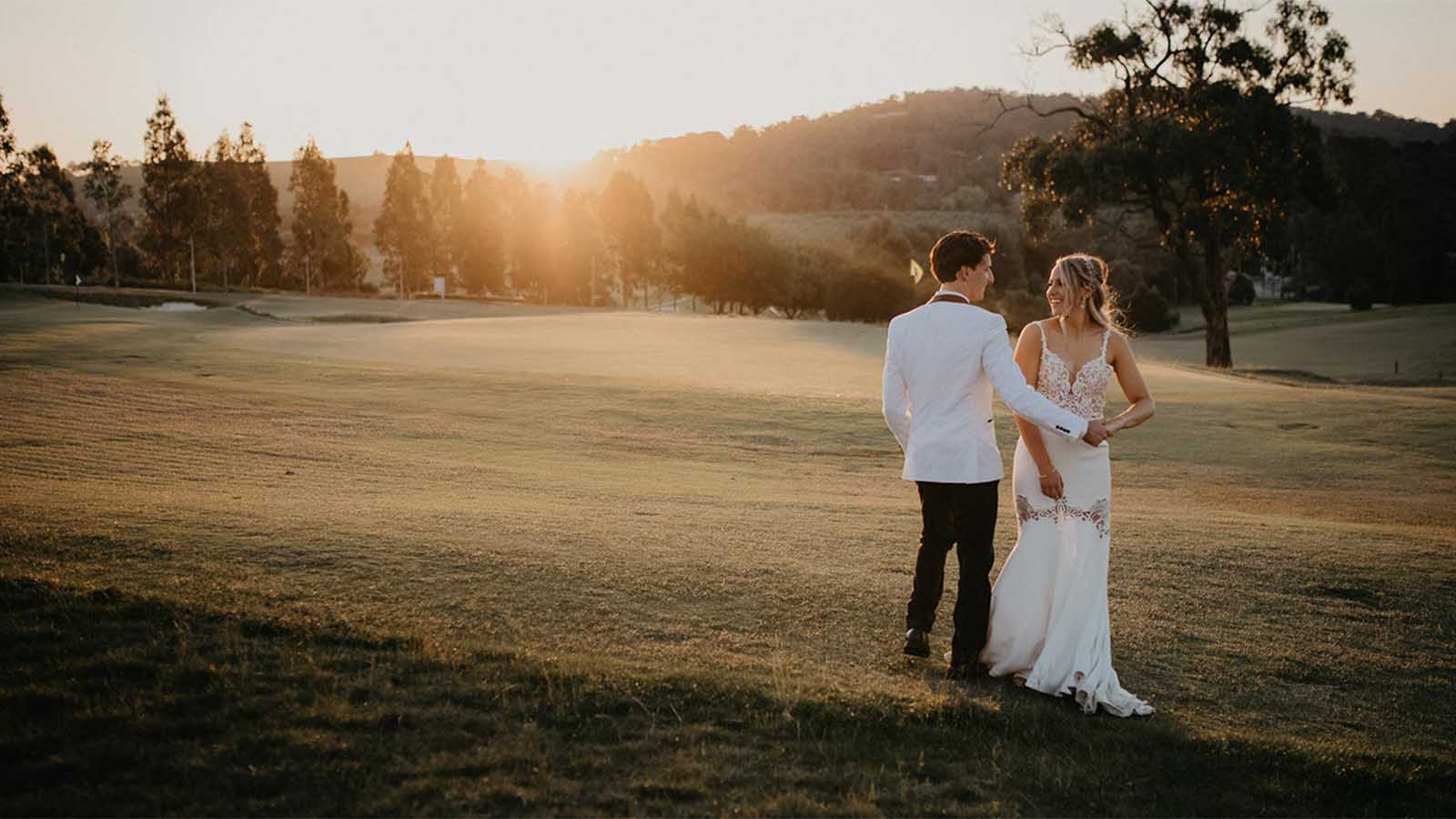 Bride and groom posing on the Healesville golf course