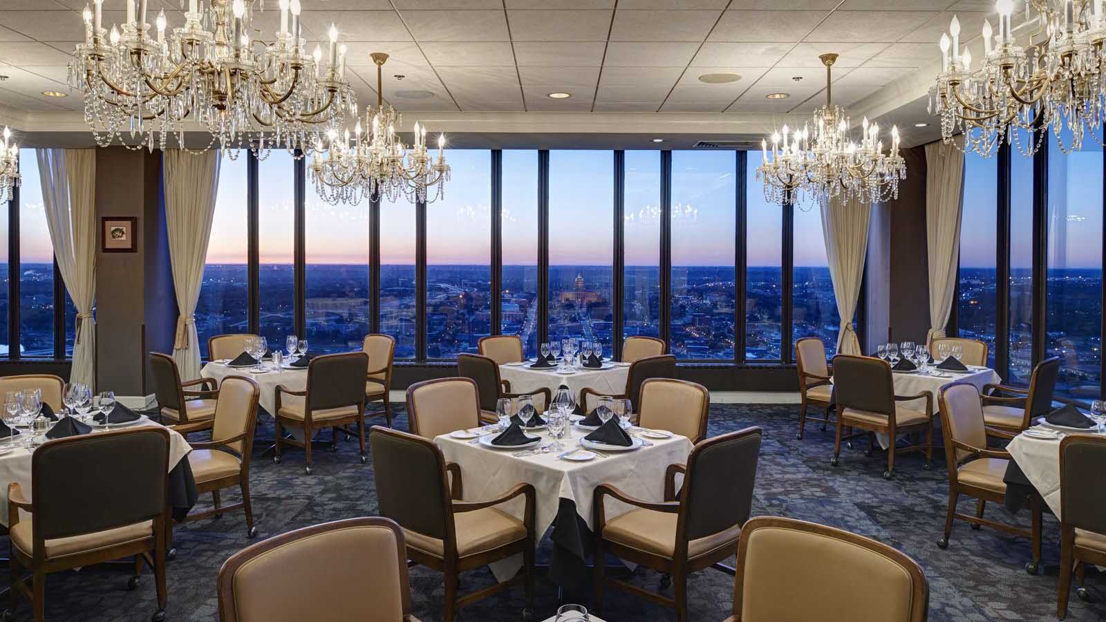 The Ruan Centre at the Des Moines Embassy Club, showing a room set up banquet style with a view of the city out the window.