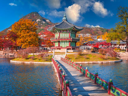 Gyeongbokgung palace in autumn, lake with blue sky, Seoul, South Korea.