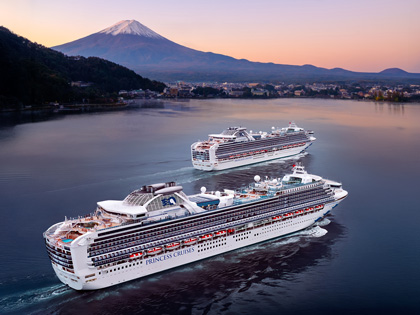 Double cruise ships sailing past Mt Fuji