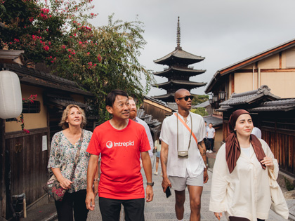 A small tour group walking through Kyoto, Japan. 