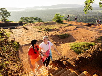 Two female friends going for a hike but an ancient monument in Sri Lanka