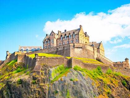 Edinburgh Castle on a sunny day with blue skies overhead