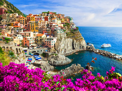 Colorful building and vibrant blue ocean in Cinque Terre