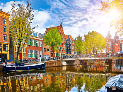 Colourful buildings along a river in Europe