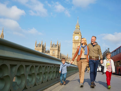 Young family walking in London city.