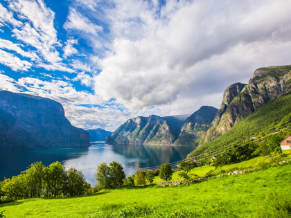 Small town in Norway with lush green hills