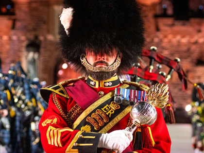 A man dressed in attire for the Royal Edinburgh Military Tattoo. 