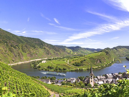 Beautiful green hills with a blue sky and old European town