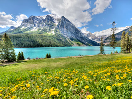 Mountains, green fields and blue waters in Alaska. 