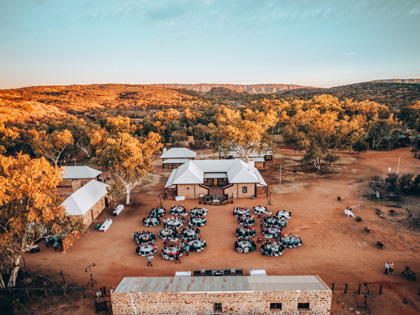 Aerial view of dinner tables set in an outback town.