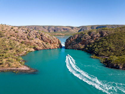 A boat going through a canal in the Kimberleys.