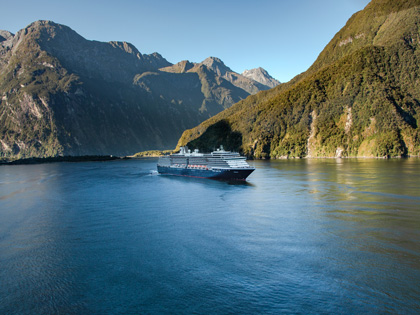 A cruise ship floating in Milford Sound