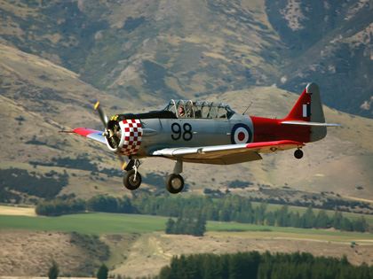 A small war plane flying in Wanaka.