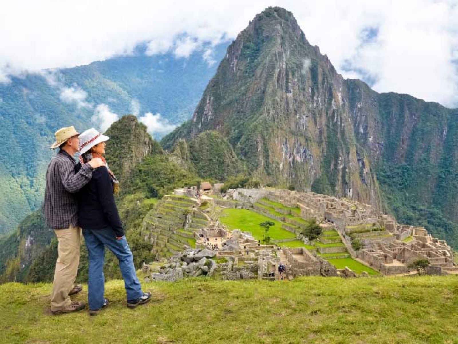 A couple looking over the Machu Piccu mountains.