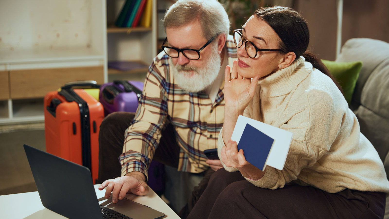 Couple on their laptop organising their travel plans