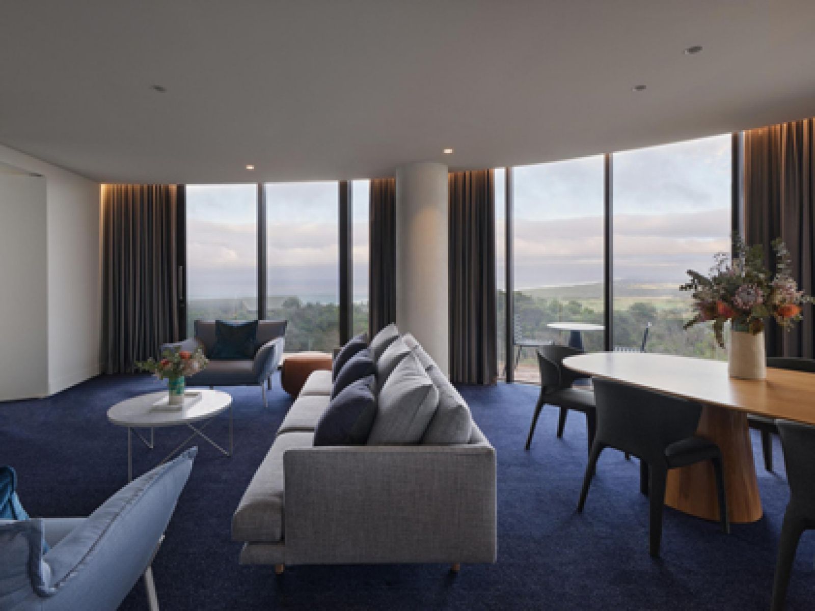 The lounge and outdoor view at RACV Cape Schanck Resort's Peninsula Suite