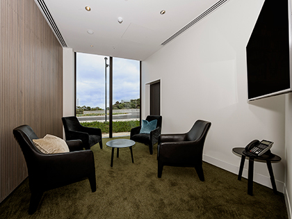 Bass 1 meeting room at RACV Cape Schanck Resort, with four couches facing each other.