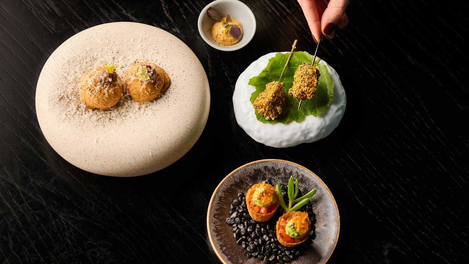 Several dishes presented beautifully.