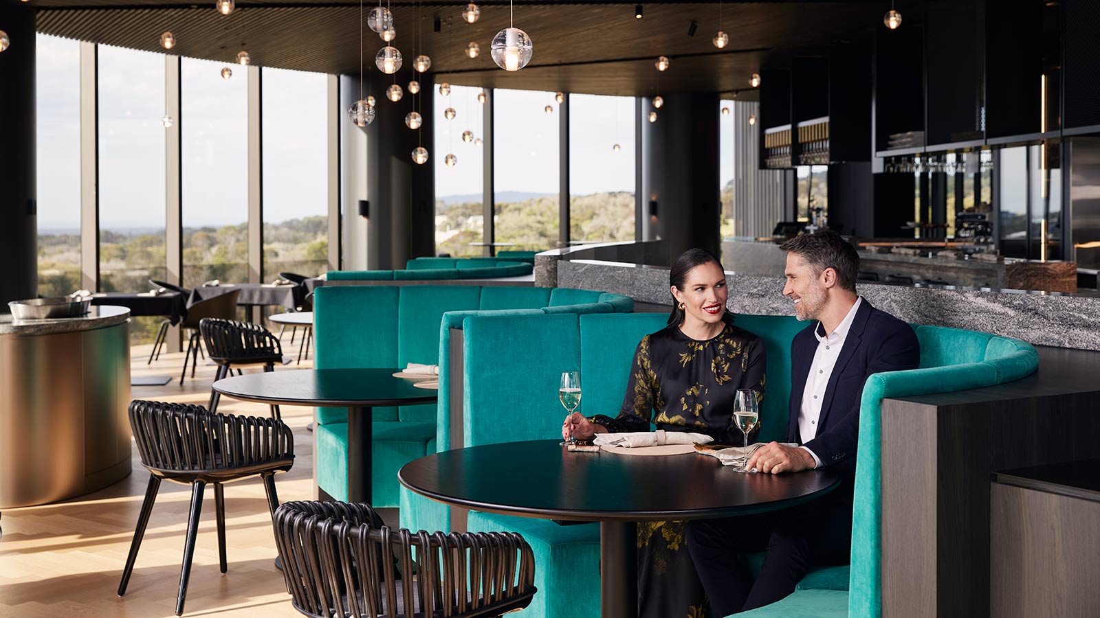 Couple sitting in a booth at Cape Schanck restaurant.