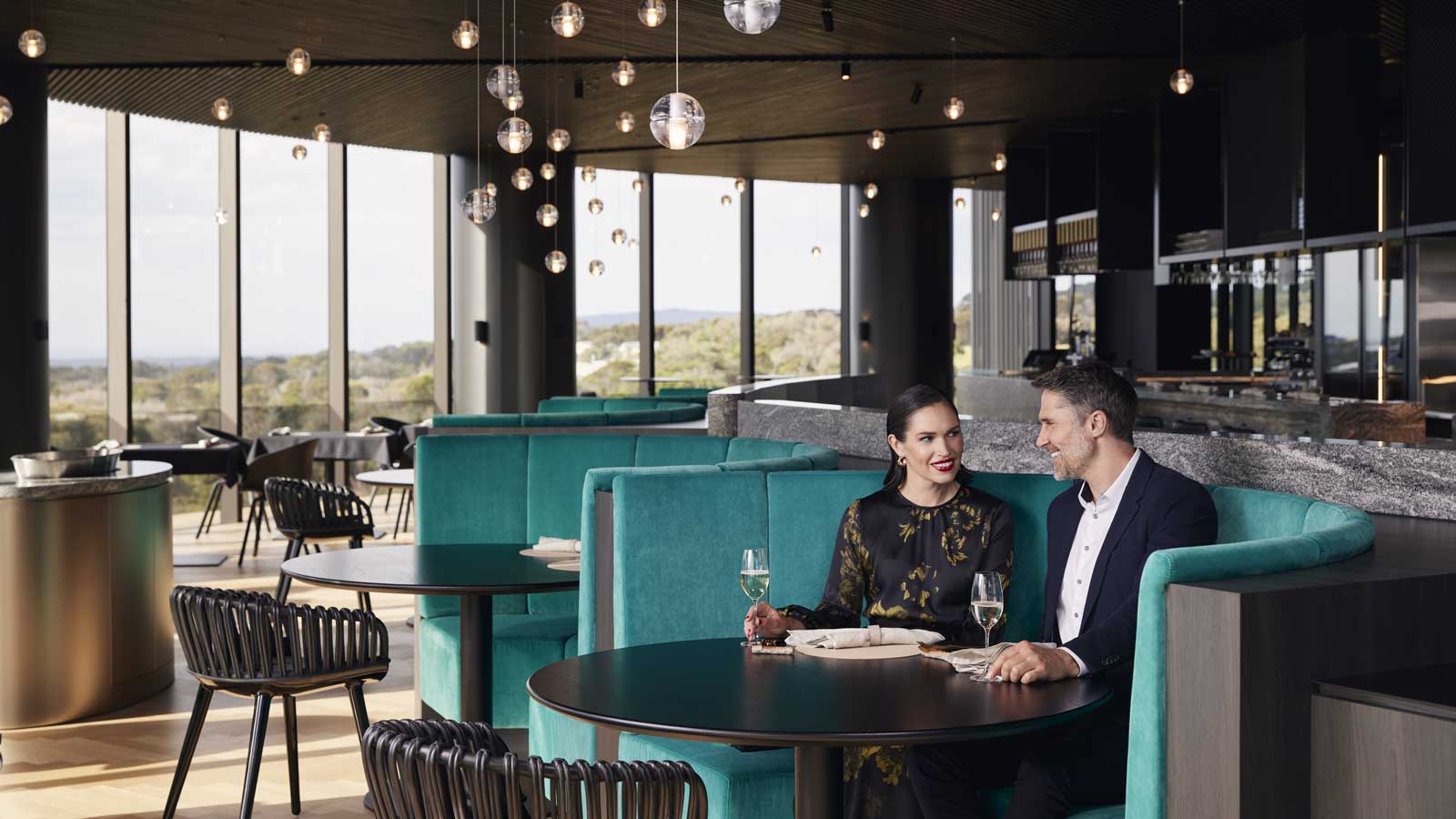 Couple enjoying a drink together at Cape Schanck