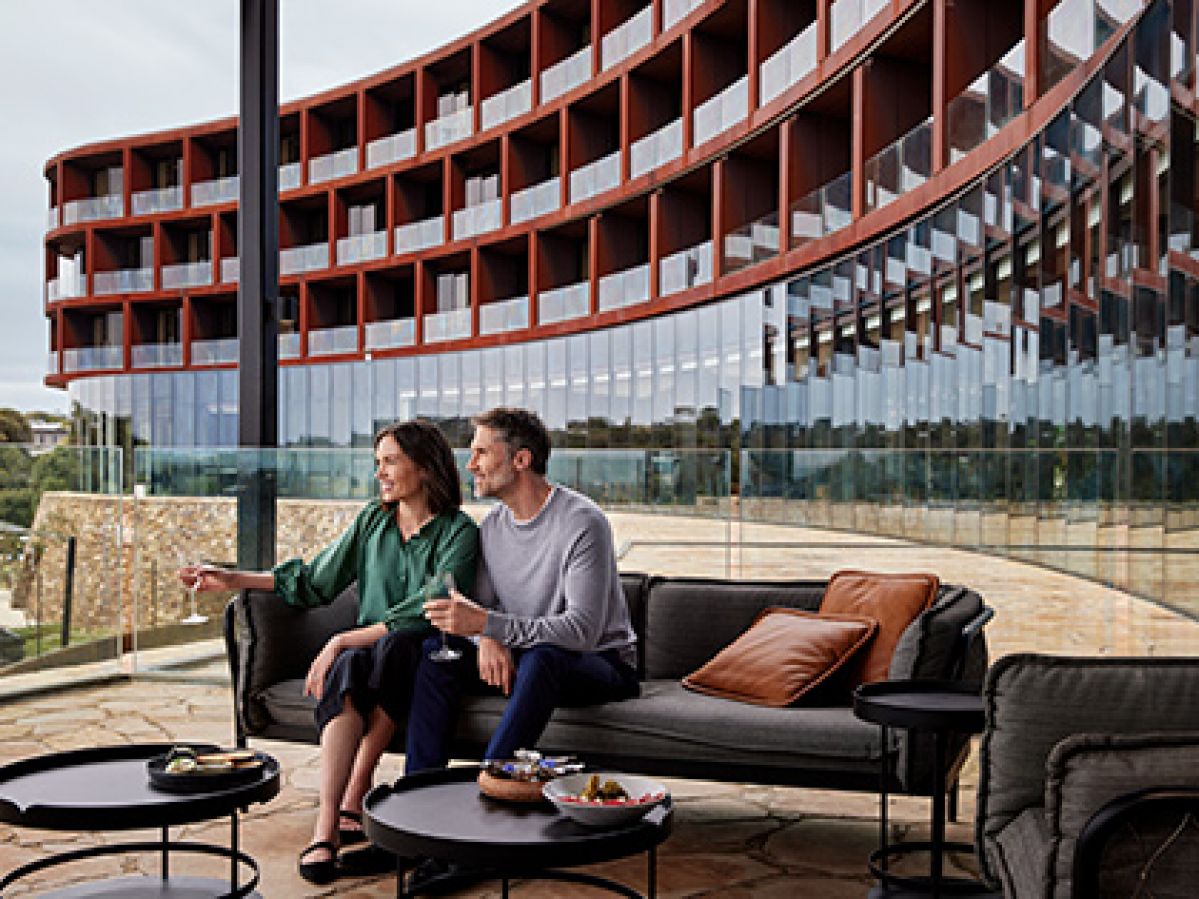 Couple sitting on a couch at RACV Cape Schanck's Cape Bar and Terrace.