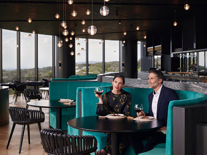Couple dining in a booth at RACV's Cape Schanck resort.