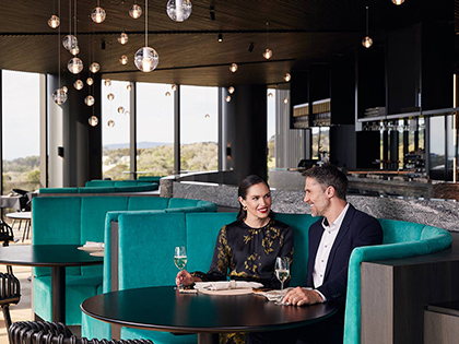 Couple sitting in a booth at Cape Schanck restaurant.
