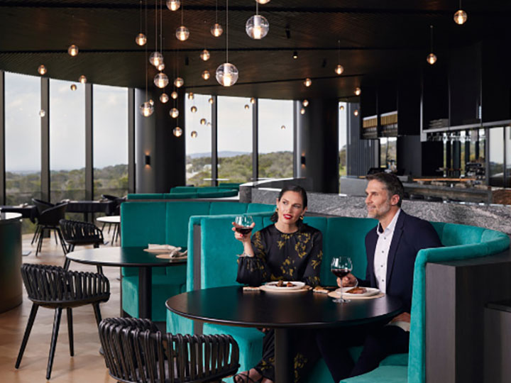 Couple dining in a booth at RACV's Cape Schanck resort.