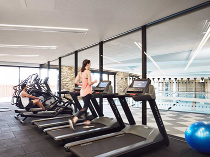 Person running on treadmill in gym at RACV Cape Schanck Resort.
